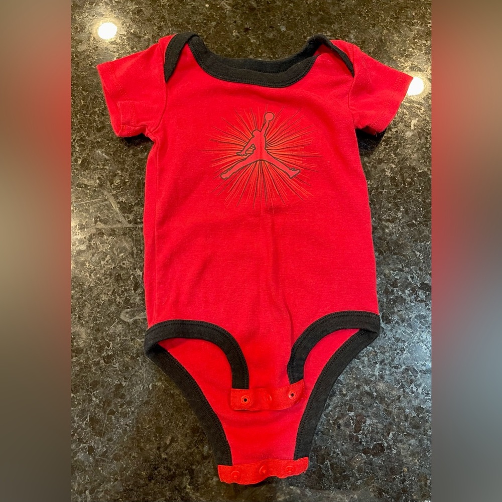 red/black Jordan onesie: size 0-6 months